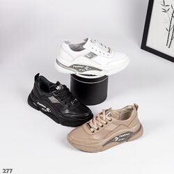 Шкіряні жіночі кросівки чорного, білого та темно-бежевого кольору