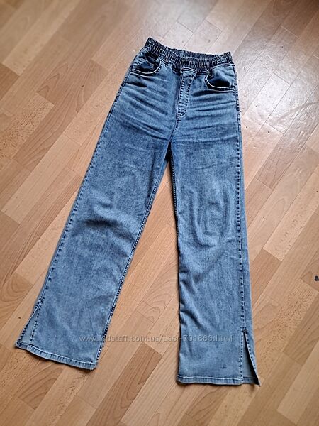 Широкі джинси кльош з розрізом 