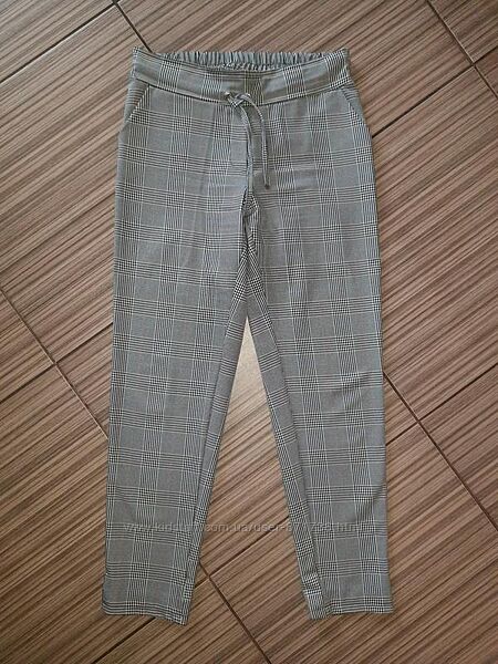 Брюки в клітинку