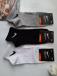 Шкарпетки чоловічі спортивні з брендовим значком однотонні різні кольори